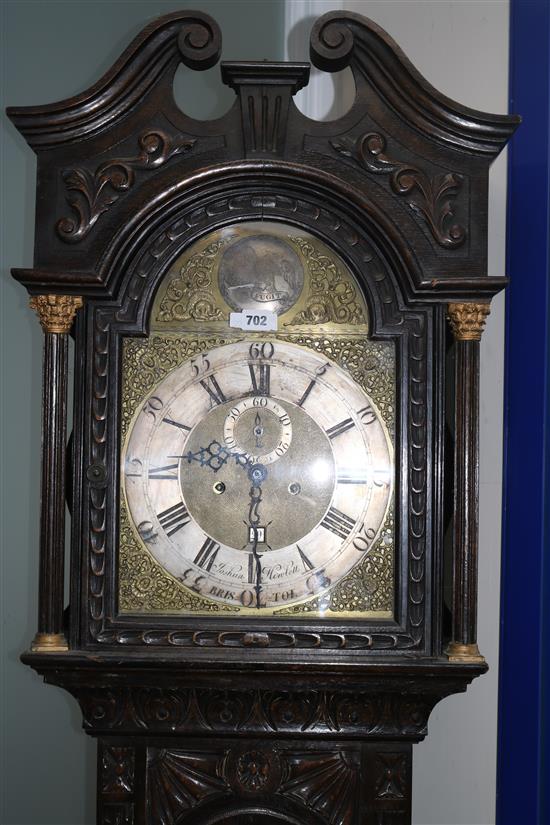 A George III carved oak longcase clock by Joshua Hewlett of Bristol